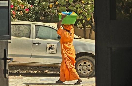 a woman walking in Senegal