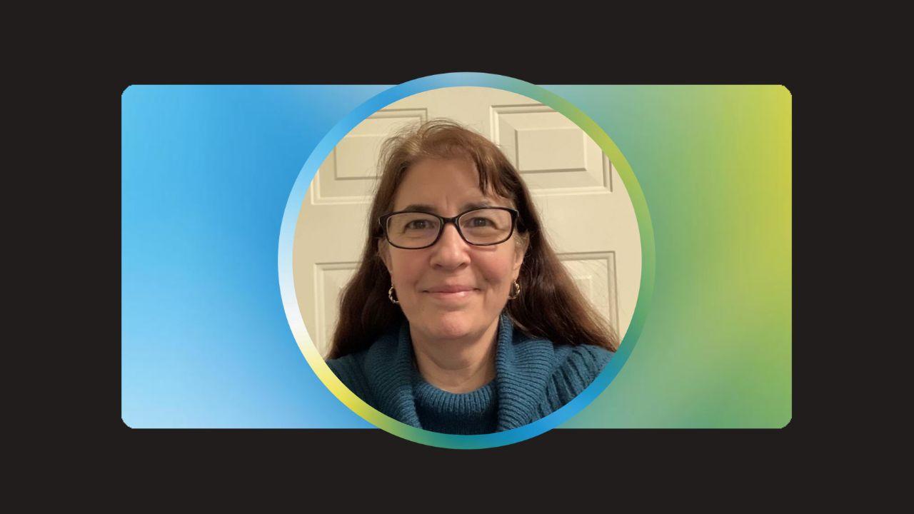 circular photo of Andra Smith on a blue and green background