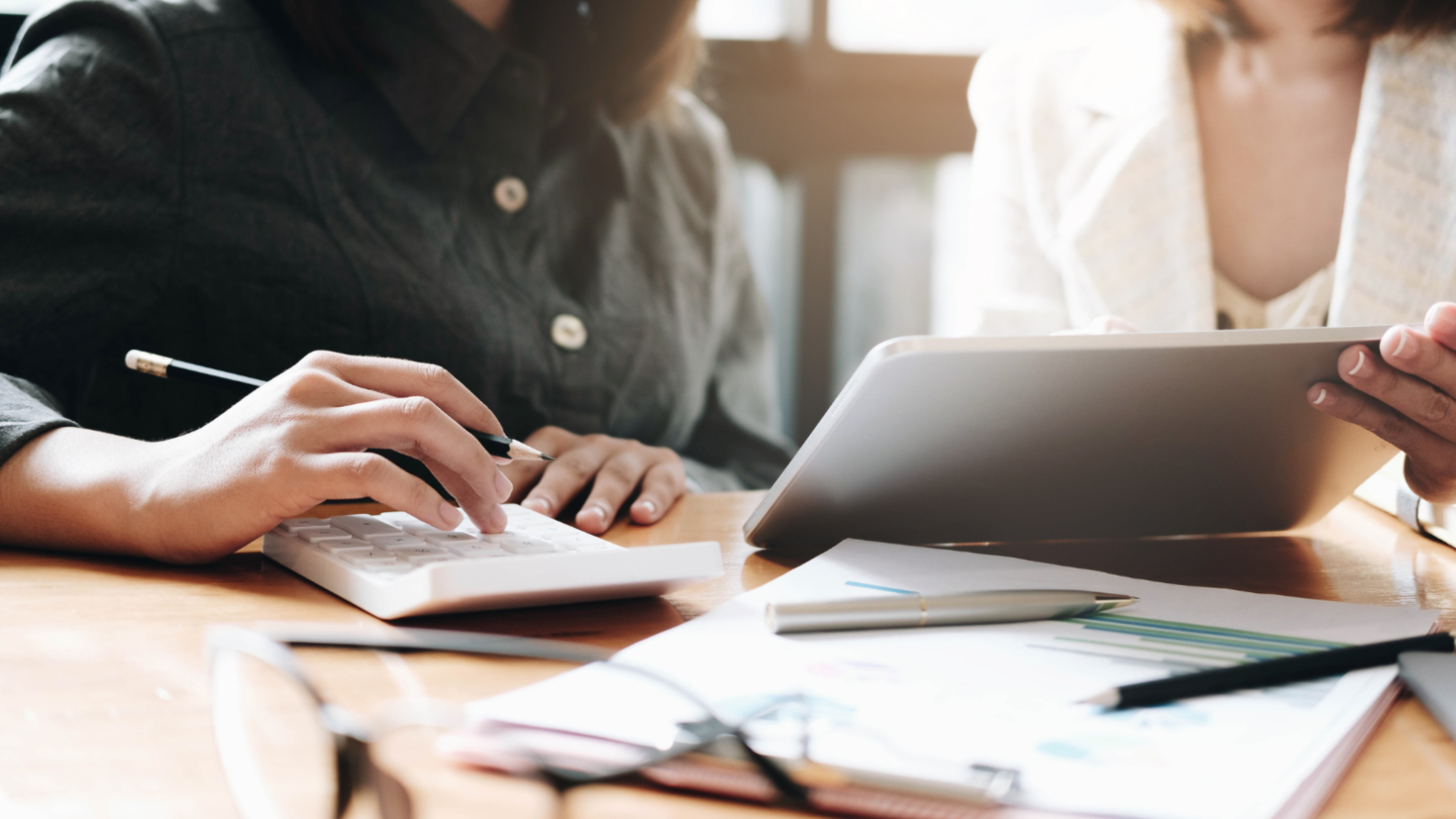 Two people looking at finances.