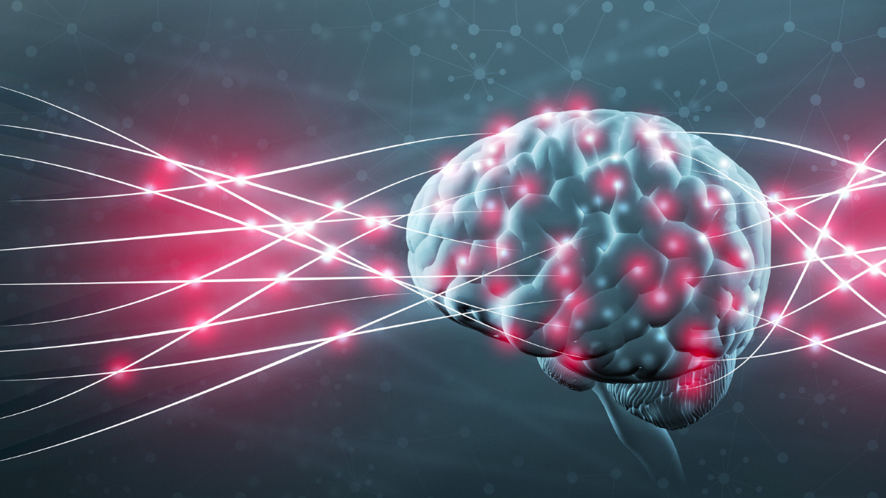 Image d'un cerveau avec des lasers rouges.