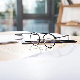 Glasses and documents on a table