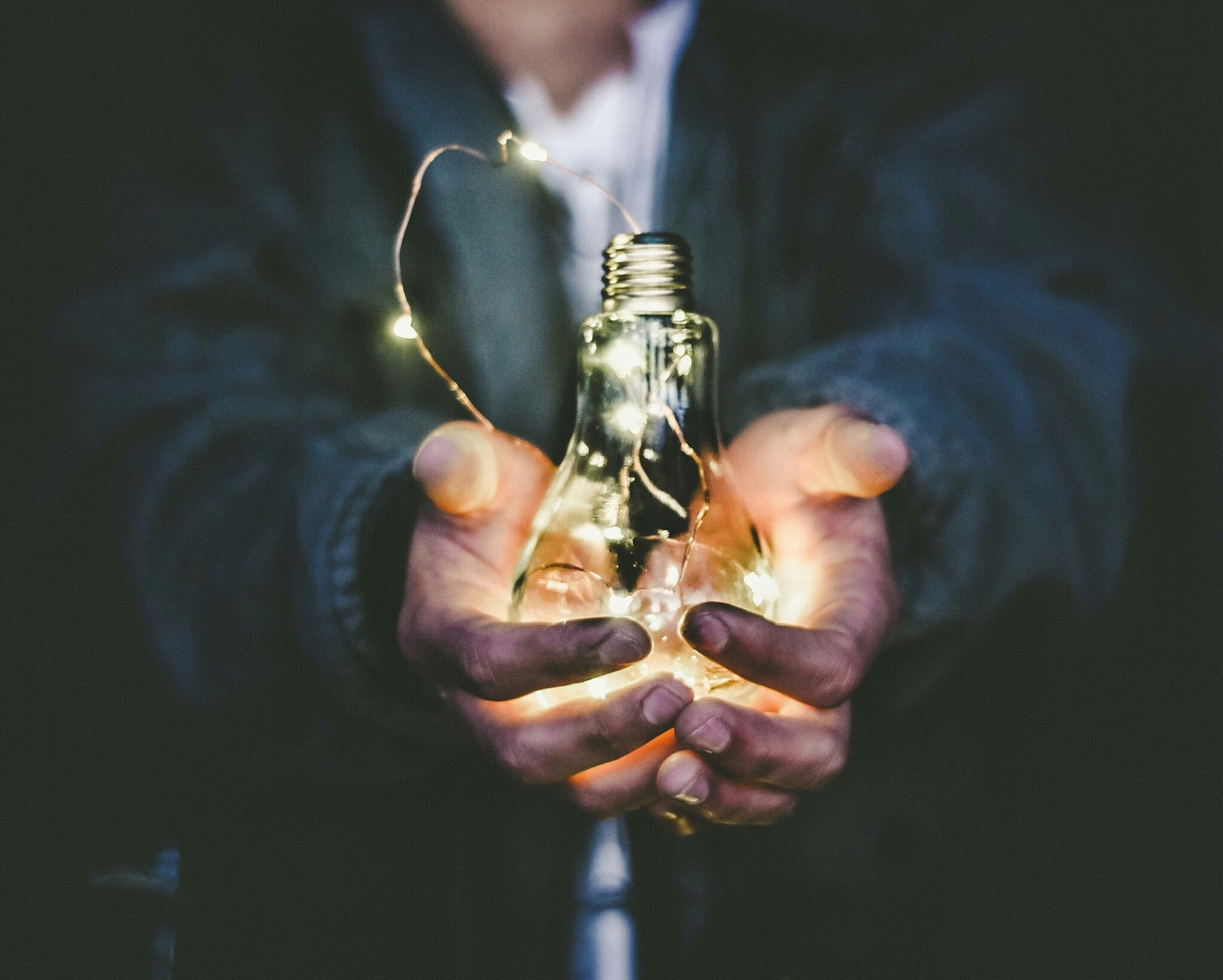 Man holding bulb light