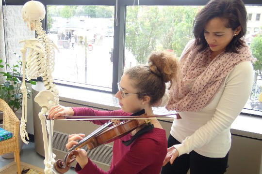 A woman playing violin