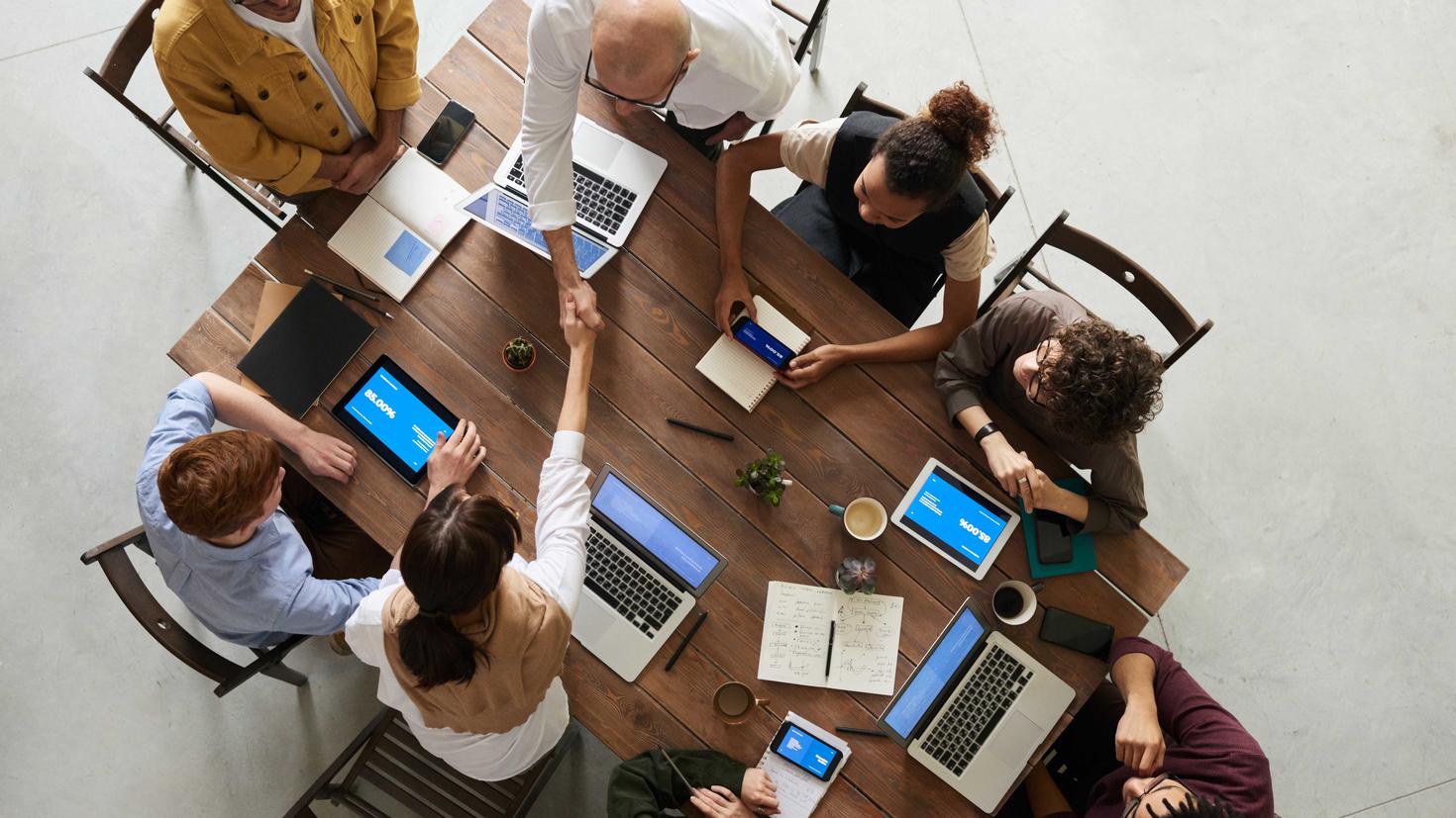 A group of people sitting around a table