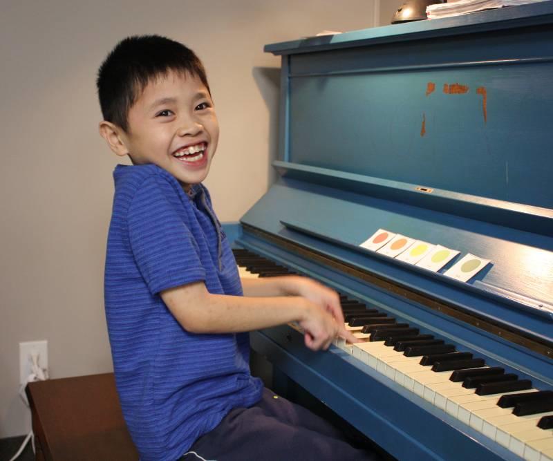 Boy playing piano