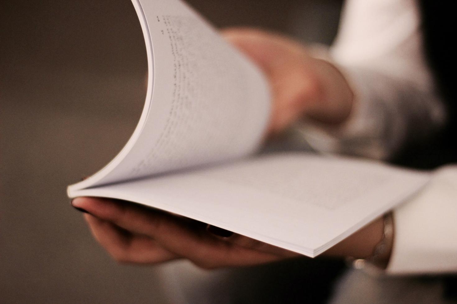 person looking in a notebook