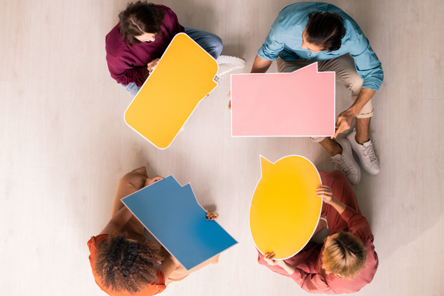 people holding speech bubbles