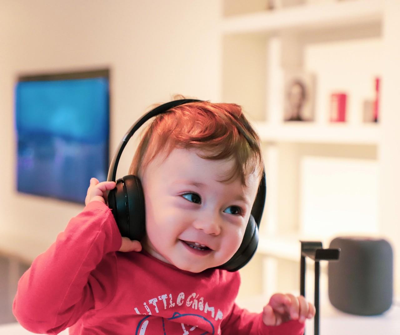 Kid with headphones over his ears