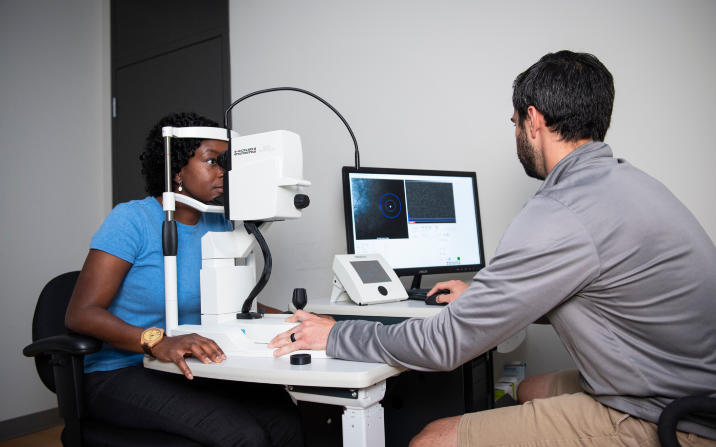 Researchers using technology to monitor patient.