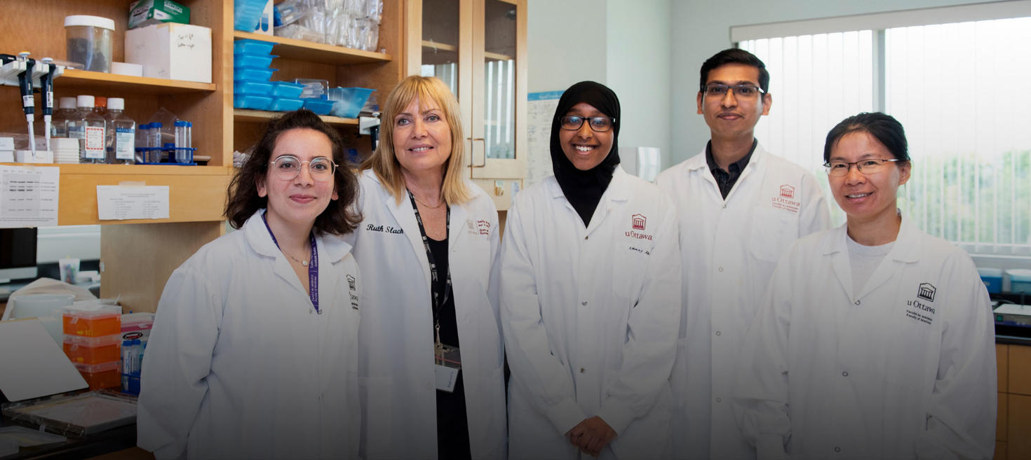 People in white lab coats posing.