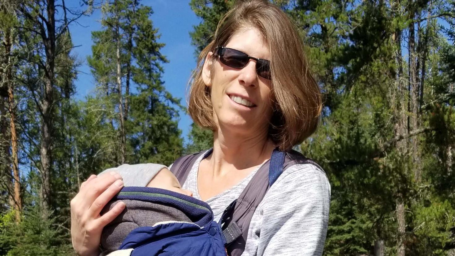 Peggy Schmeiser holding an infant