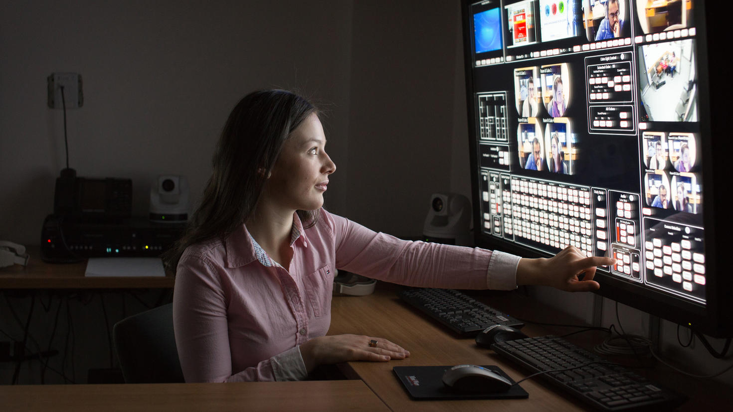 Woman working in the INSPIRE Lab control room