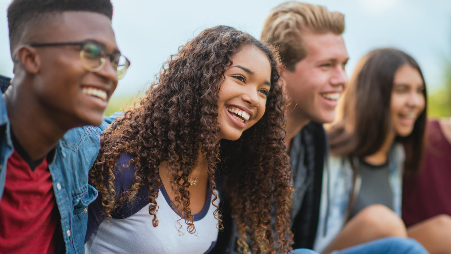 Four students smiling