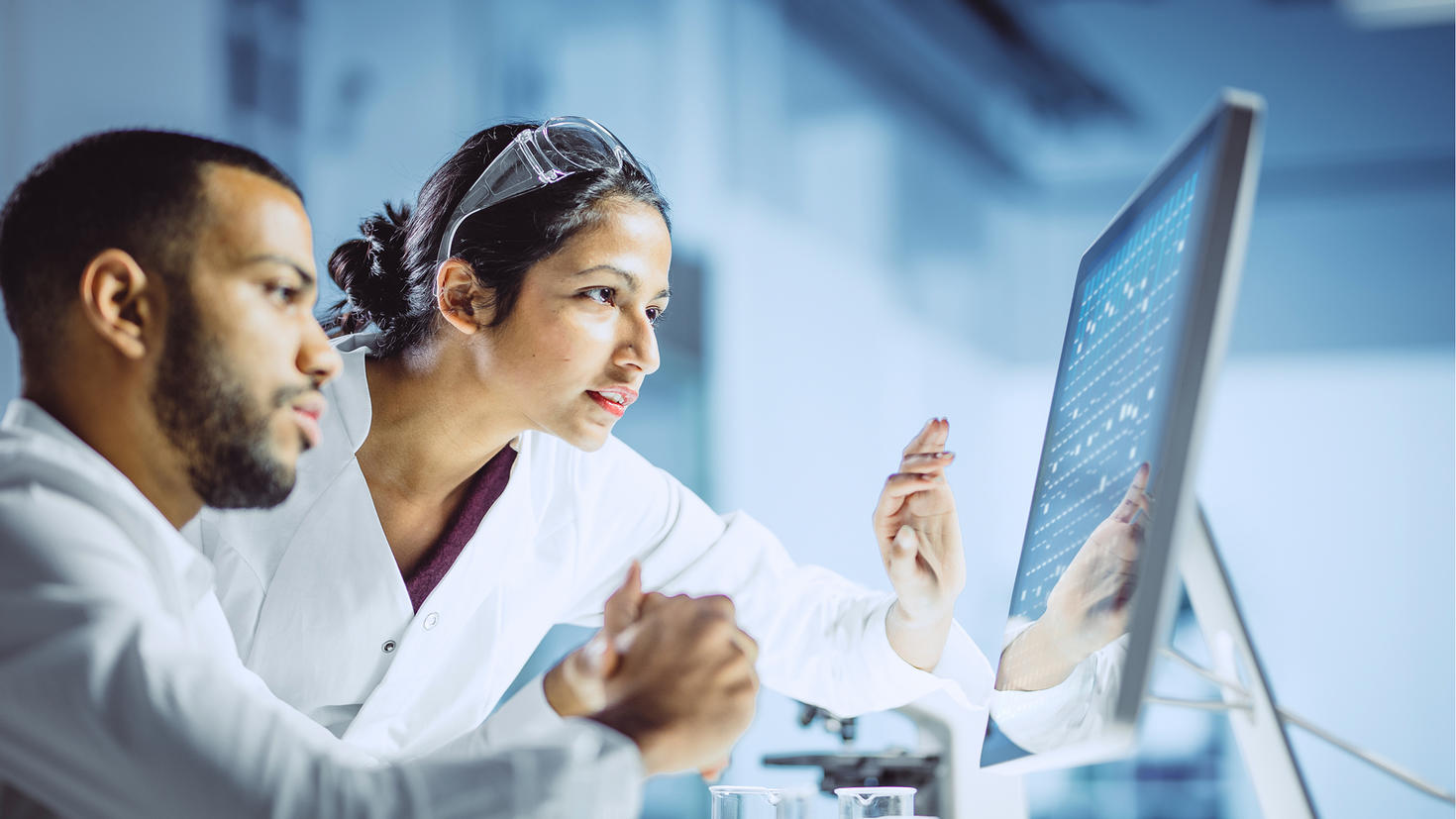 A male and female researcher collaborating