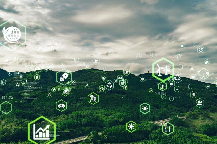Green landscape with sustainability icons overlay