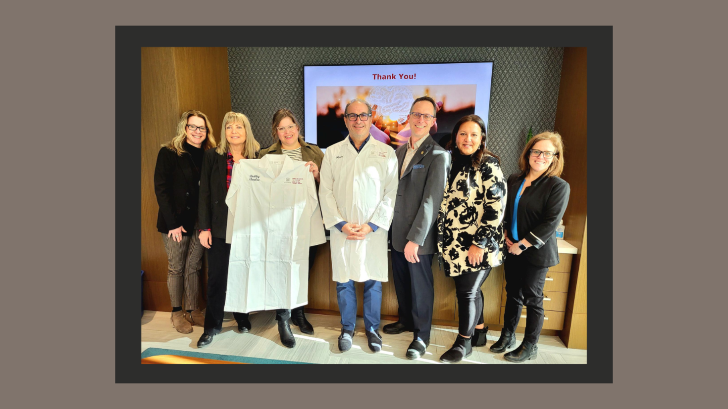 uOBMRI and JNF team members standing and smiling together. 