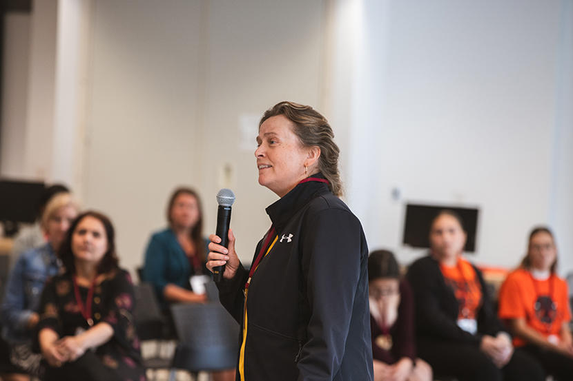 Dr. Clare Liddy speaks to an audience.