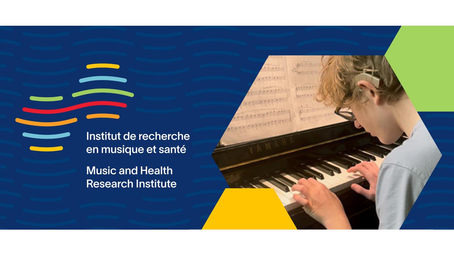 Boy with cochlear implant playing piano