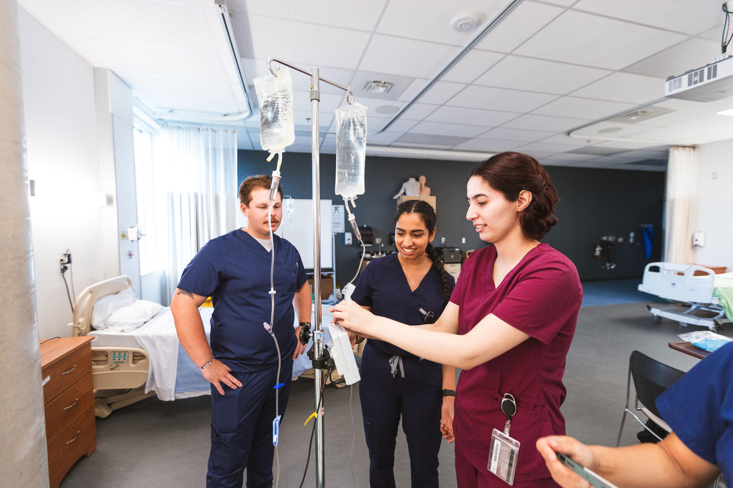 Image of three medical students in a lab