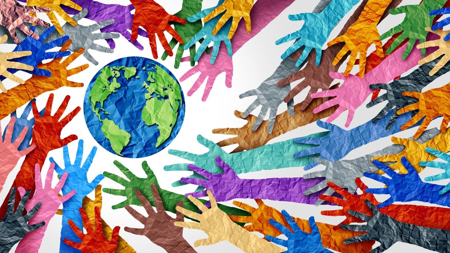 Colorful paper hands around a paper globe
