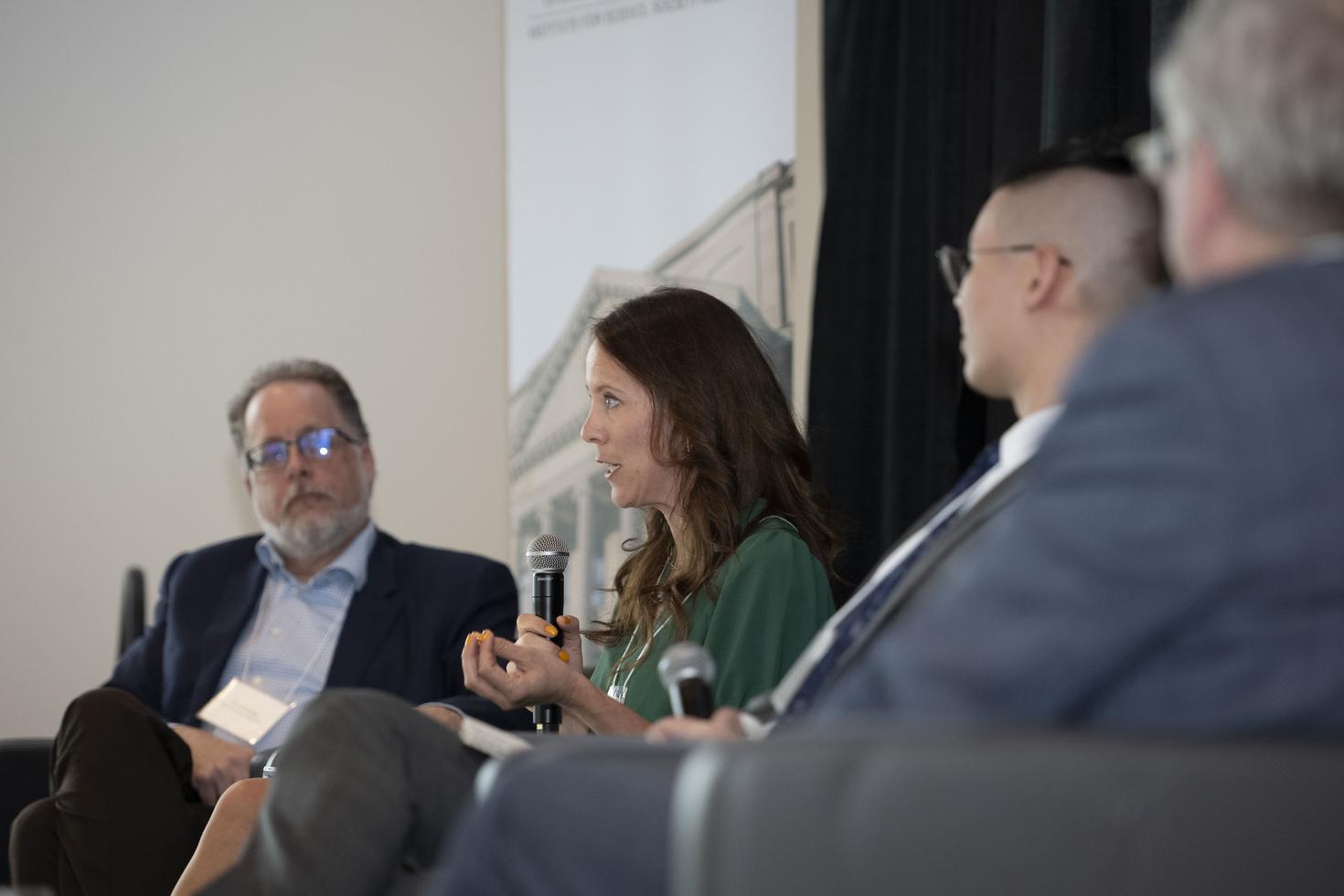 Woman speaking into a microphone