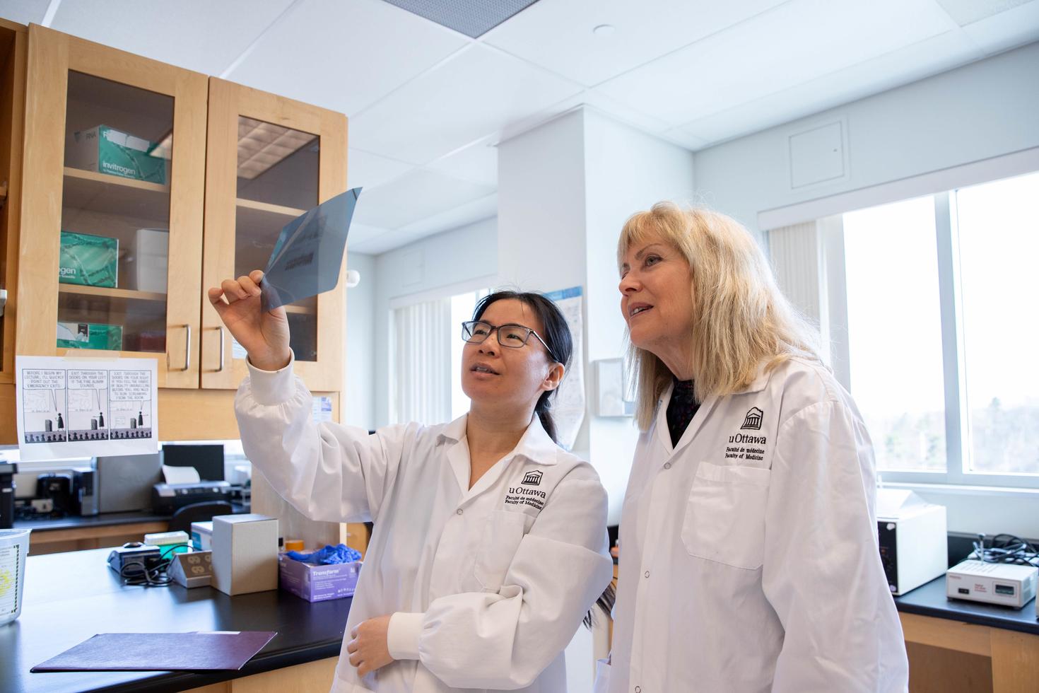 Ruth Slack and a colleague in a lab