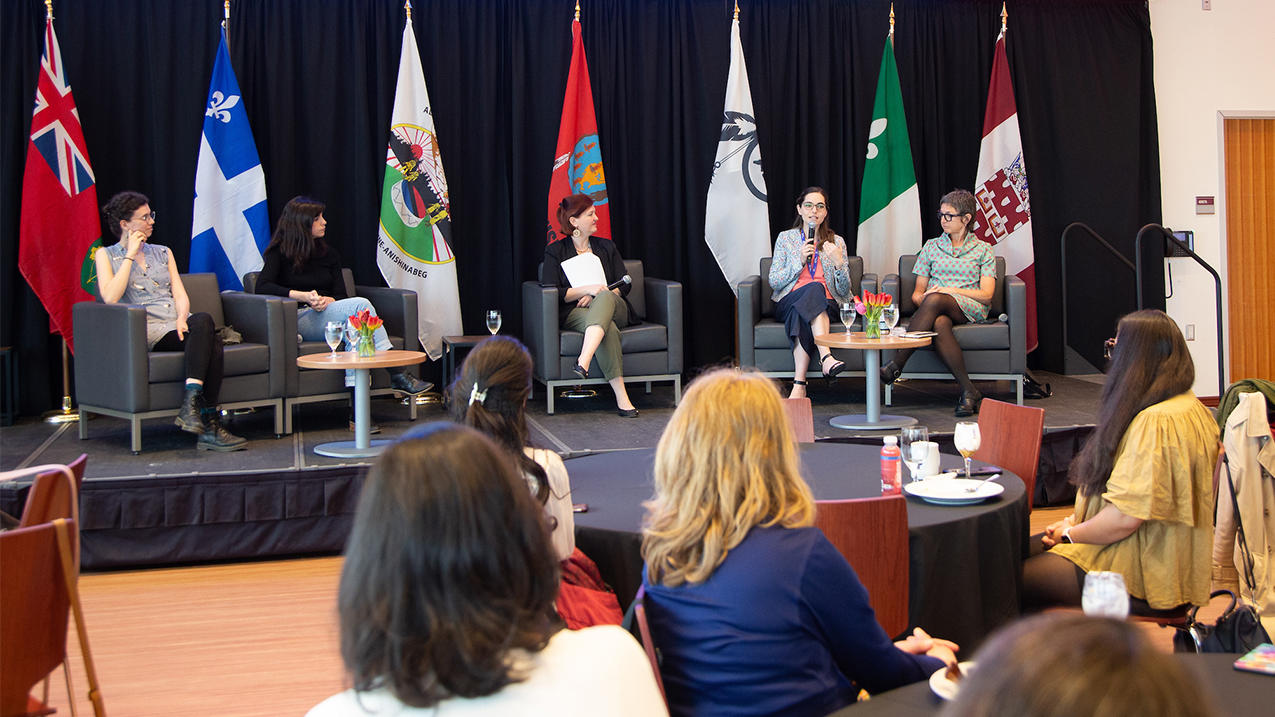 Four women panelists on stage