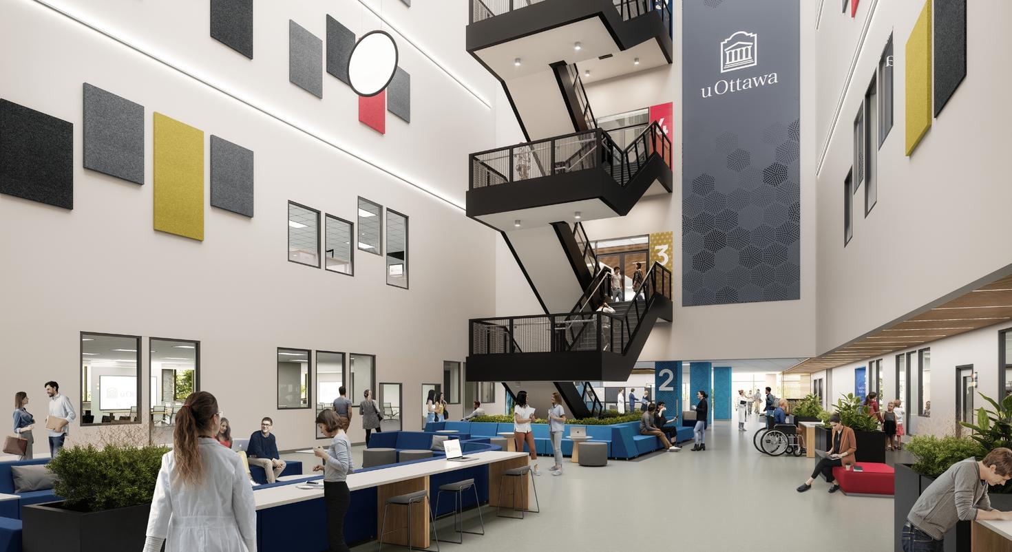 A modern, open and bright space with people passing through, and an open staircase to the upper floors.