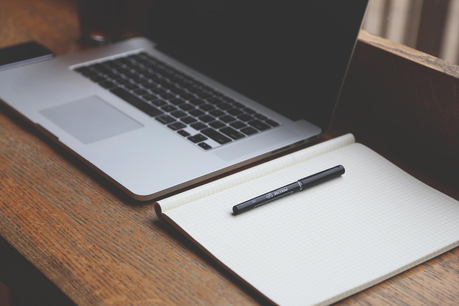 Laptop and notepad