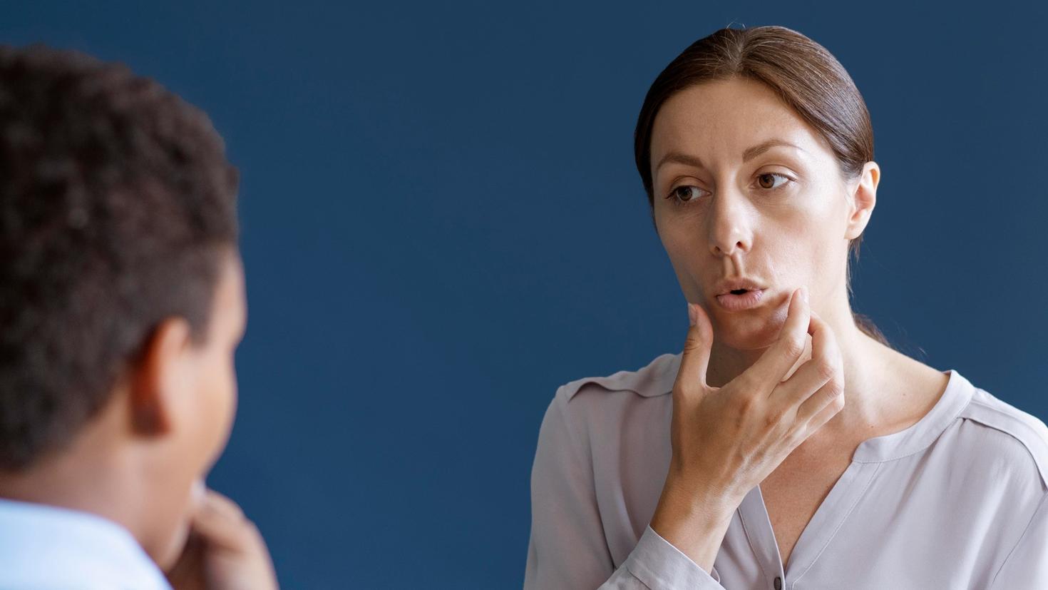 Boy having occupational therapy session with psychologist