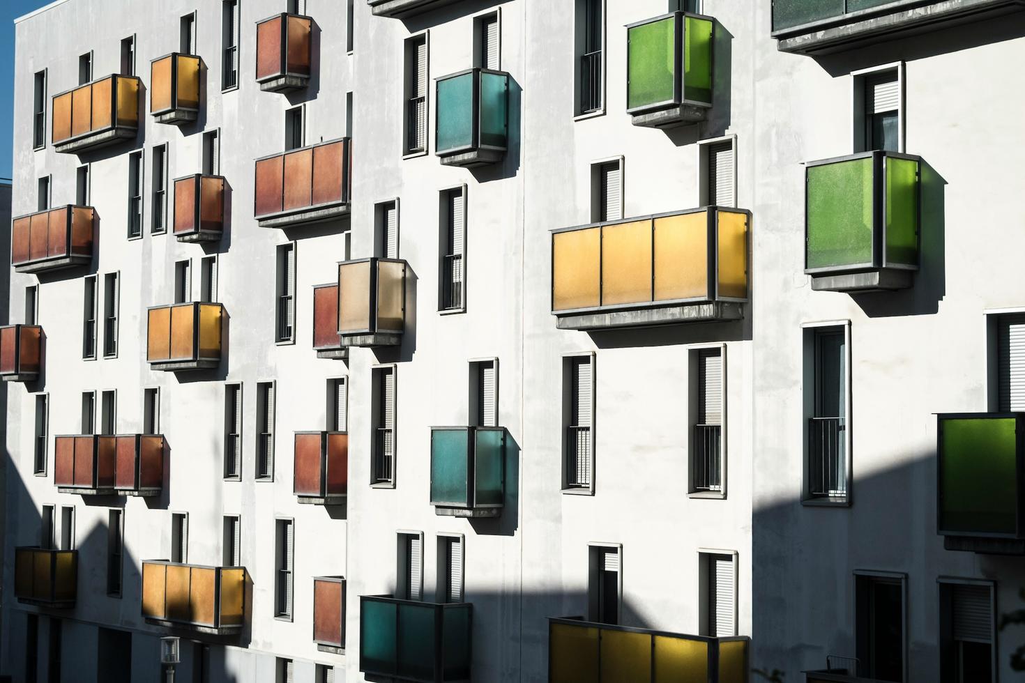 White apartment building with multiple balconies