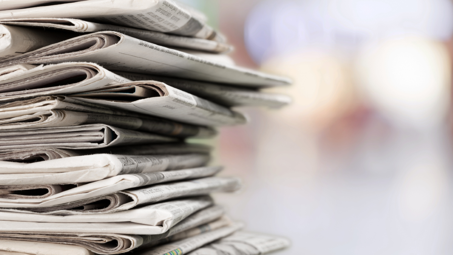 An image of a stack of news papers.