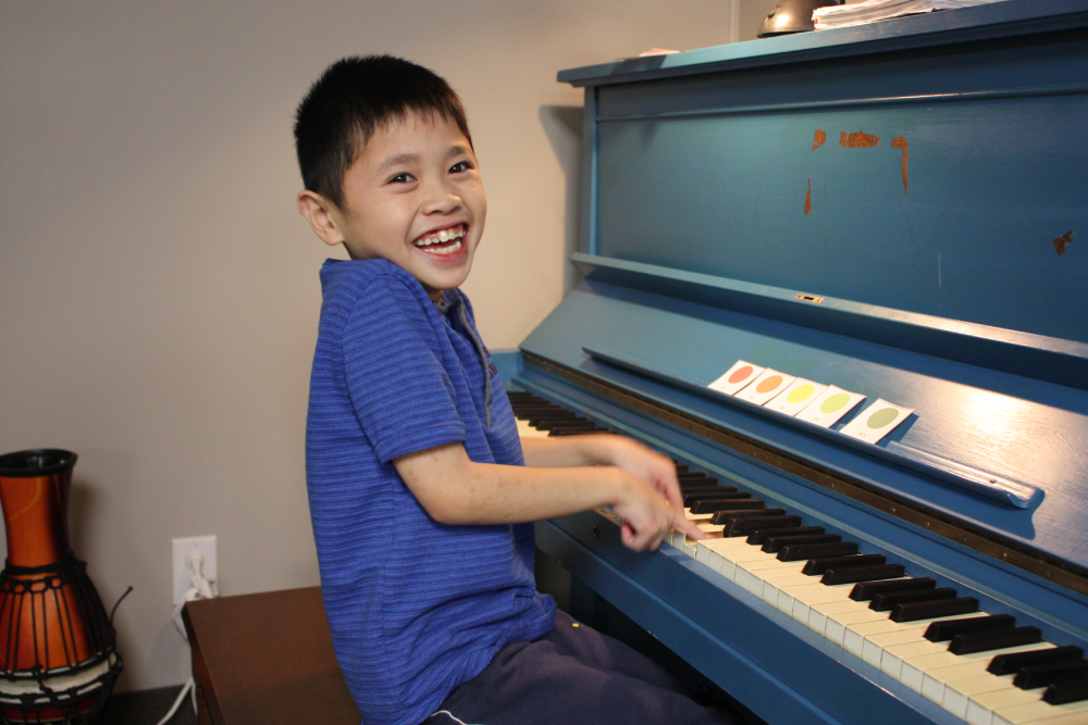 Boy playing piano