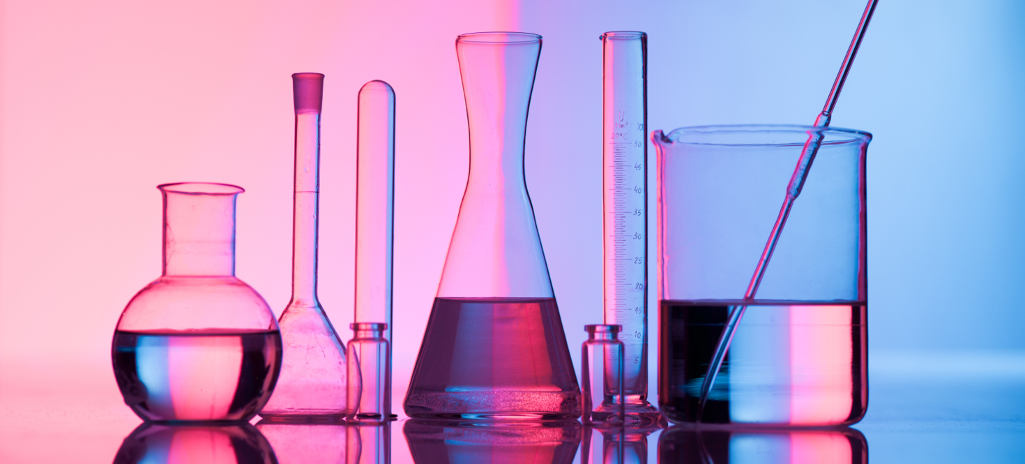 Beakers against a pink and blue background