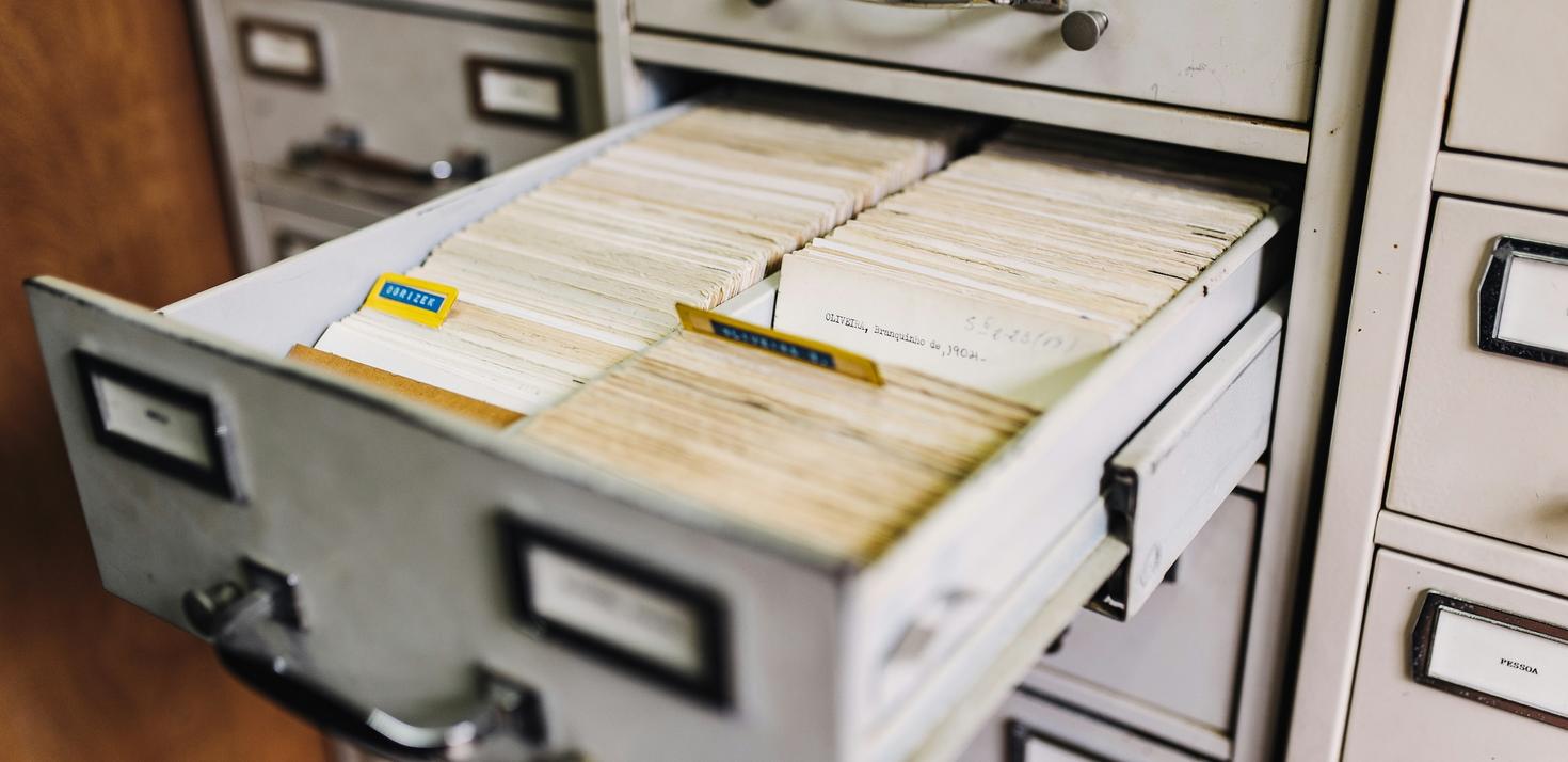 Open filing cabinet filled with organized index cards