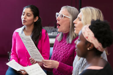 Four women singing