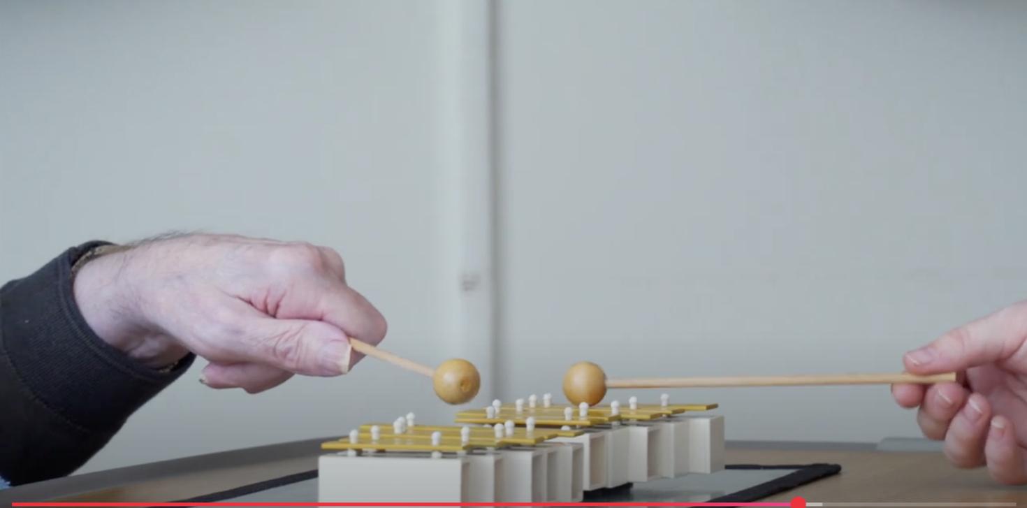 People playing the xylophone.