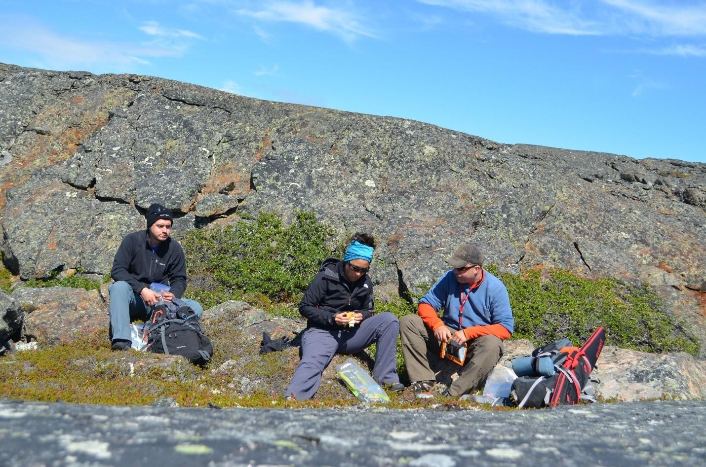 From left: Christian Sole, Professor Hanika Rizo and Professor Jonathan O'Neil collecting rock samples.