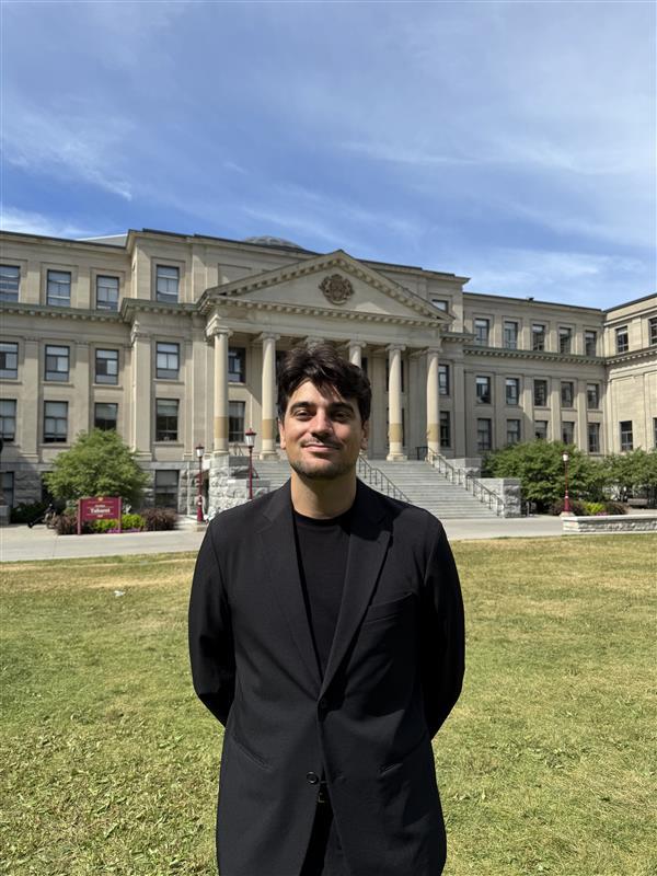 Picture of Arthur Roullin in front of Tabaret Hall, uOttawa