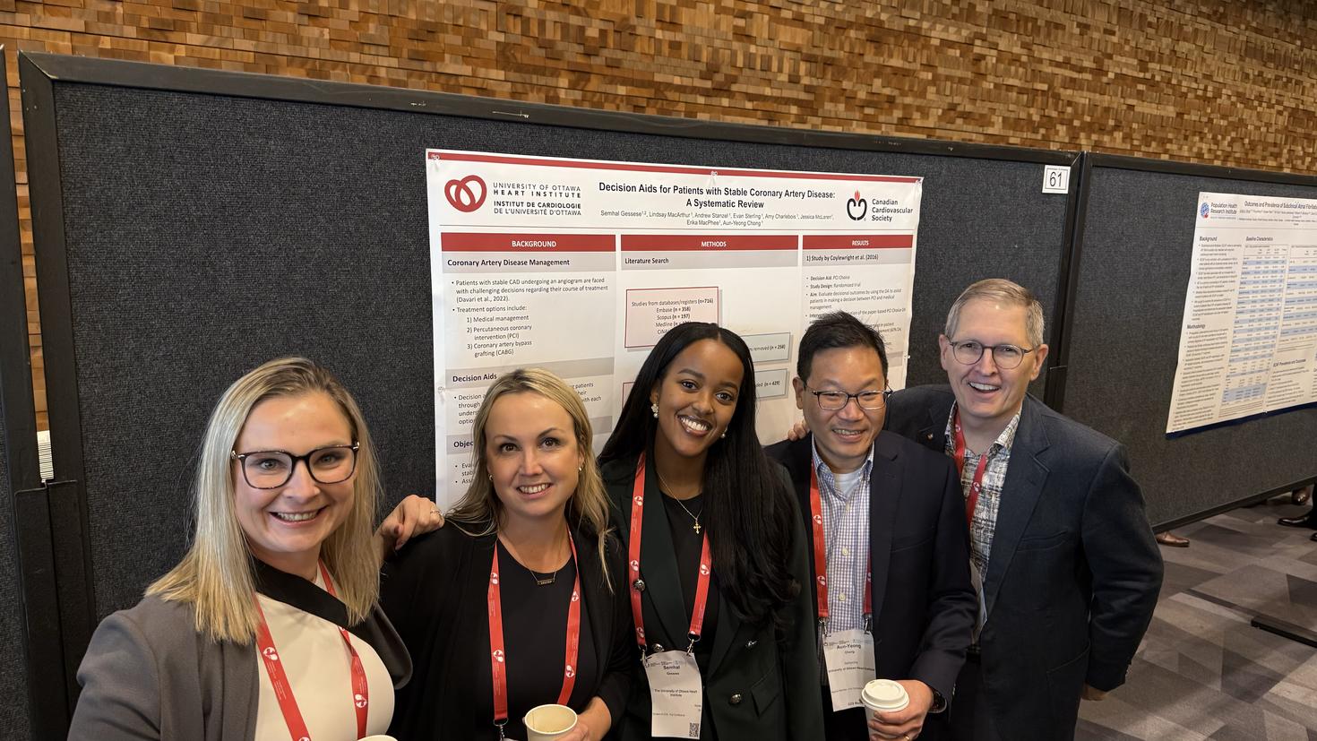 Semhal Sisay Gessese with others infront of a poster.