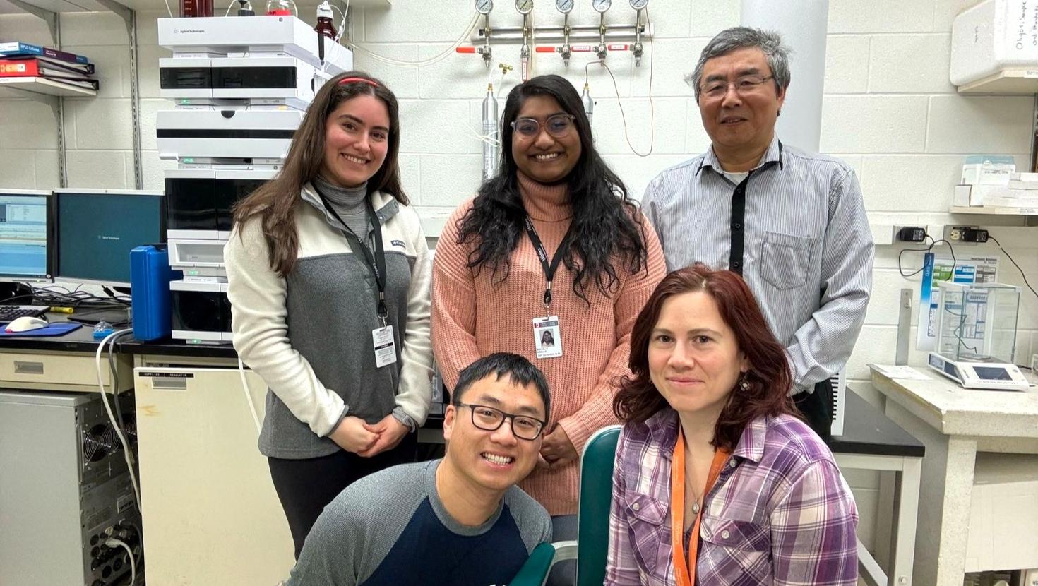 (Left to right) Dr. Zilin Zhou and Dr. Anca Baesu (front row) with Graduate student Vanessa Martinez, Research Technician Rochelle D'Mello, and Dr Yong-lai Feng (back row)
