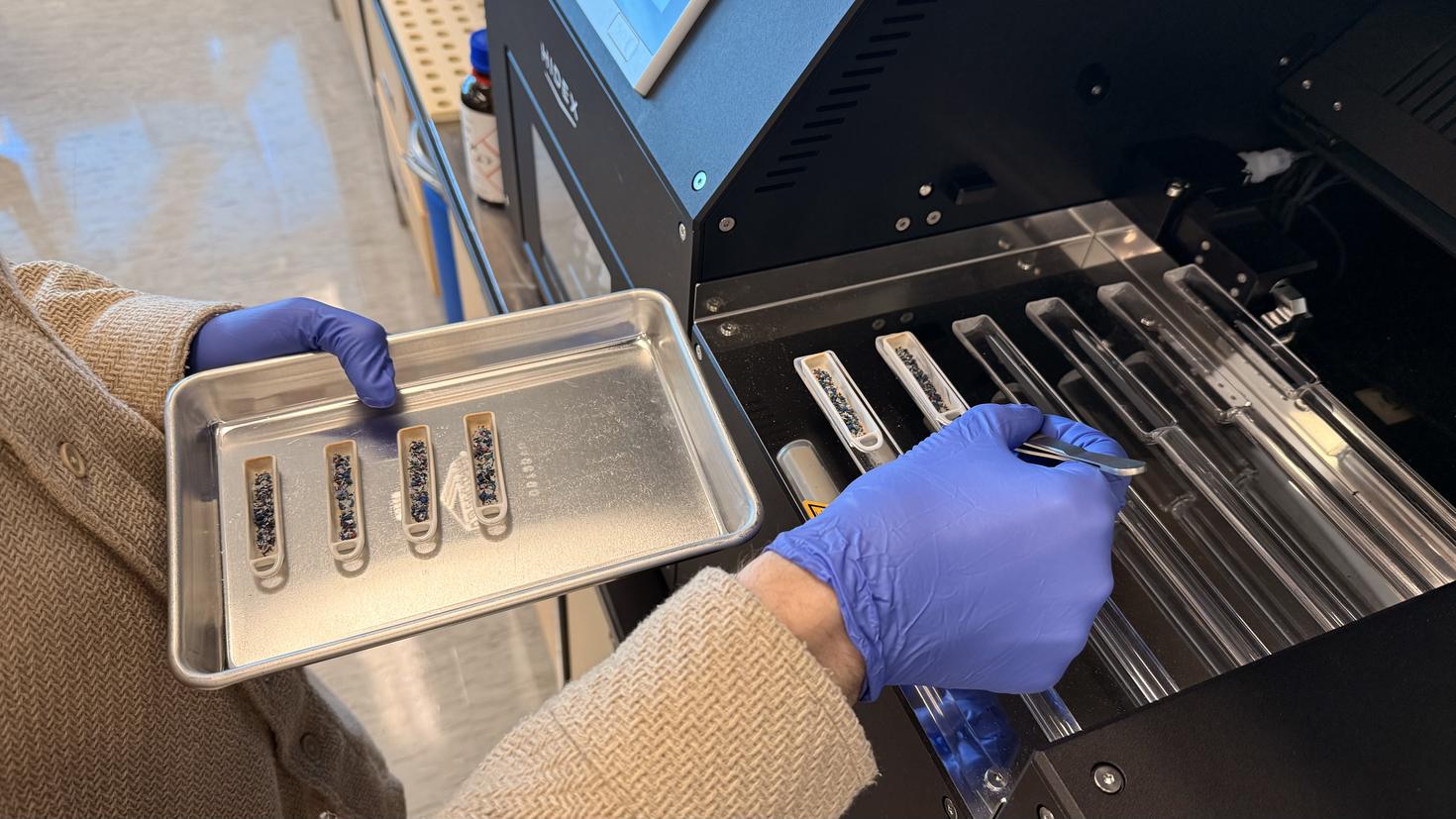 Biocarbon samples being loaded into the oxidizer