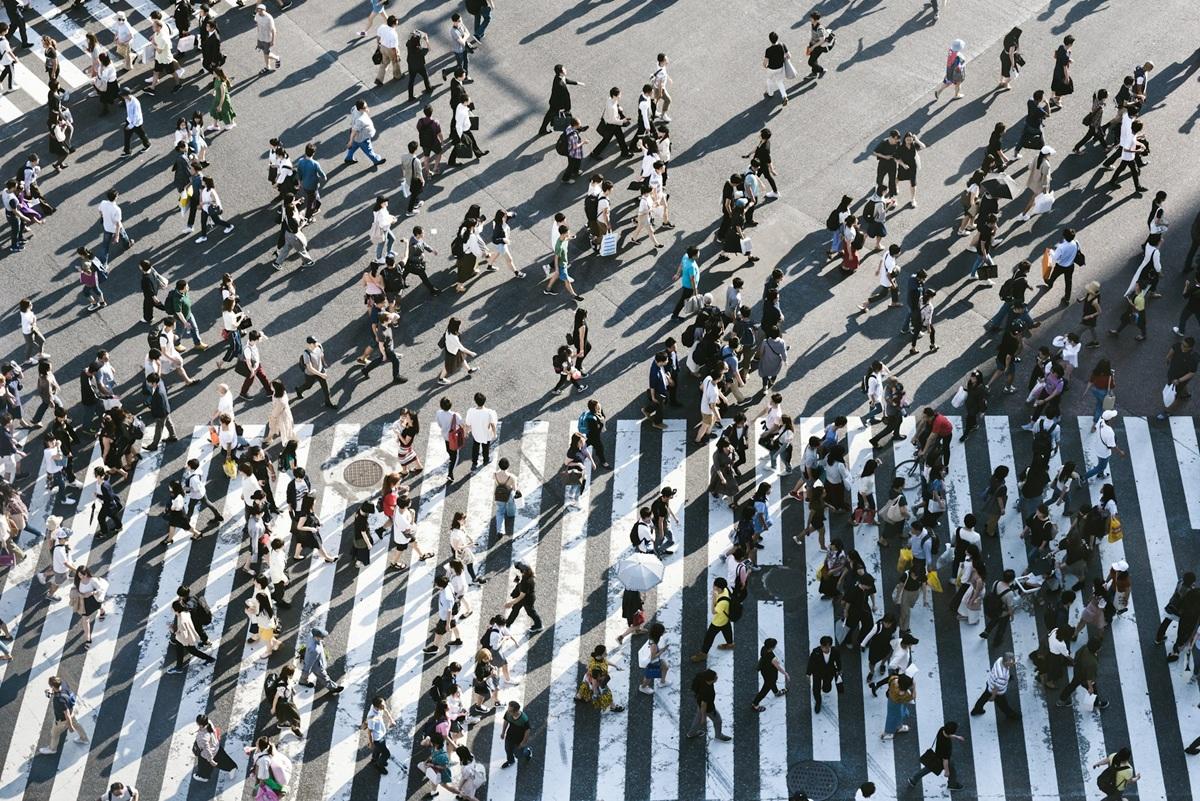 Hundreds of pedestrians crossing a crosswalk in Tokyo