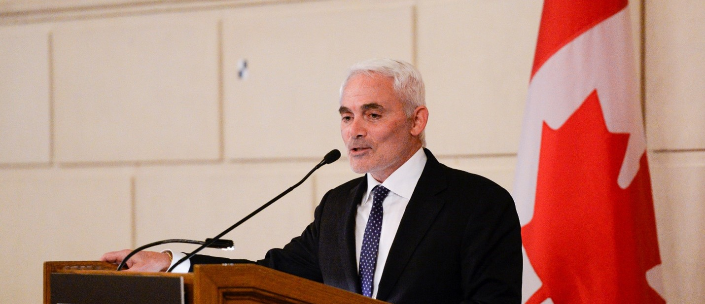 Frank Giustra at a podium