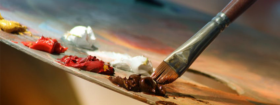 uOttawa artist Image showing an artist's palette with globs of paint in yellow, orange, red and brown and a paint brish