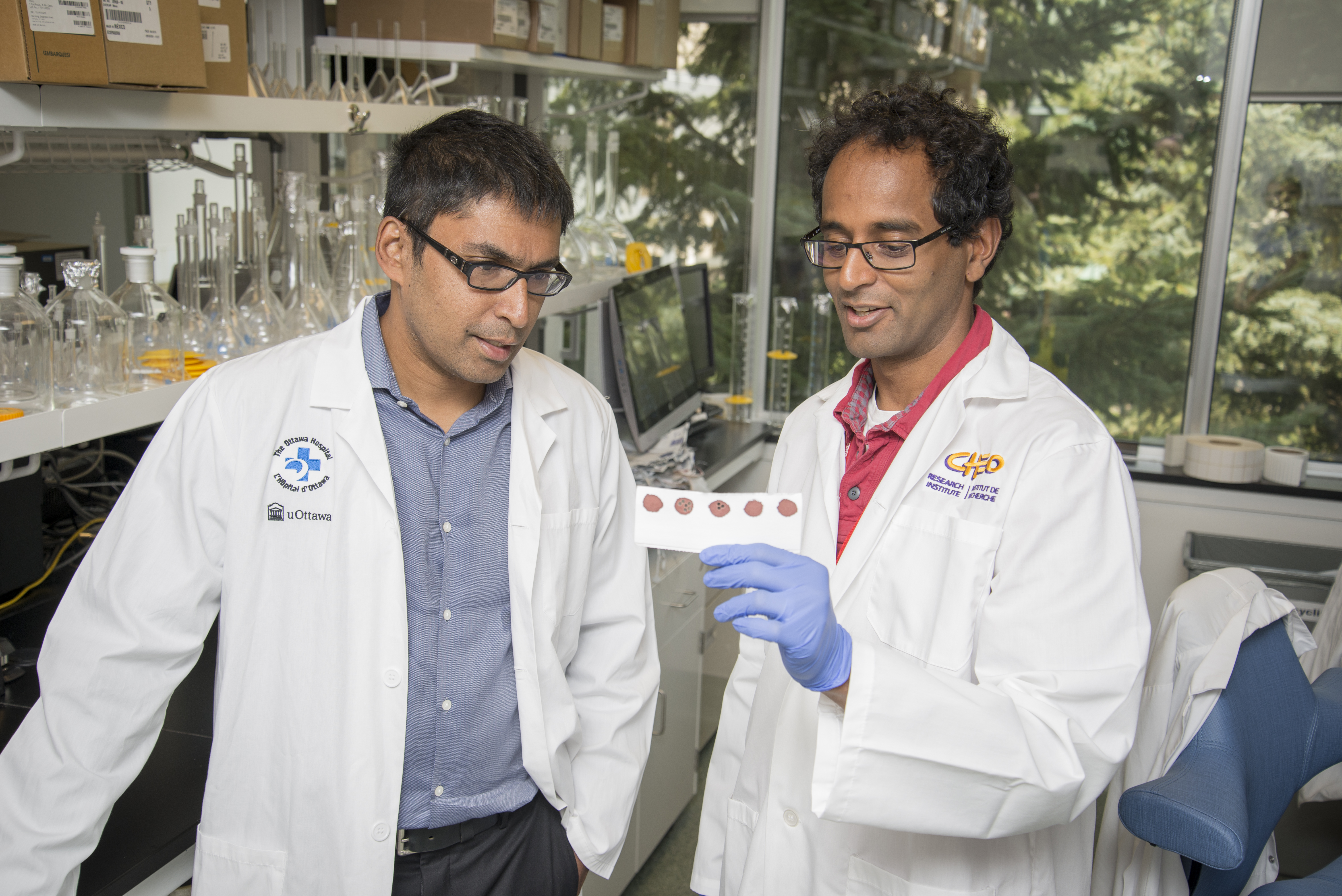 Dr. Kumanan Wilson and Dr. Pranesh Chakraborty Dr. Kumanan Wilson and Dr. Pranesh Chakraborty in laboratory.