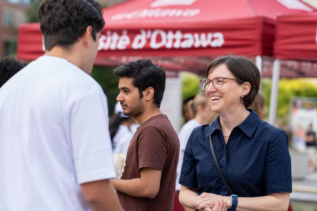 Marie-Eve Sylvestre chatting with one student during an event