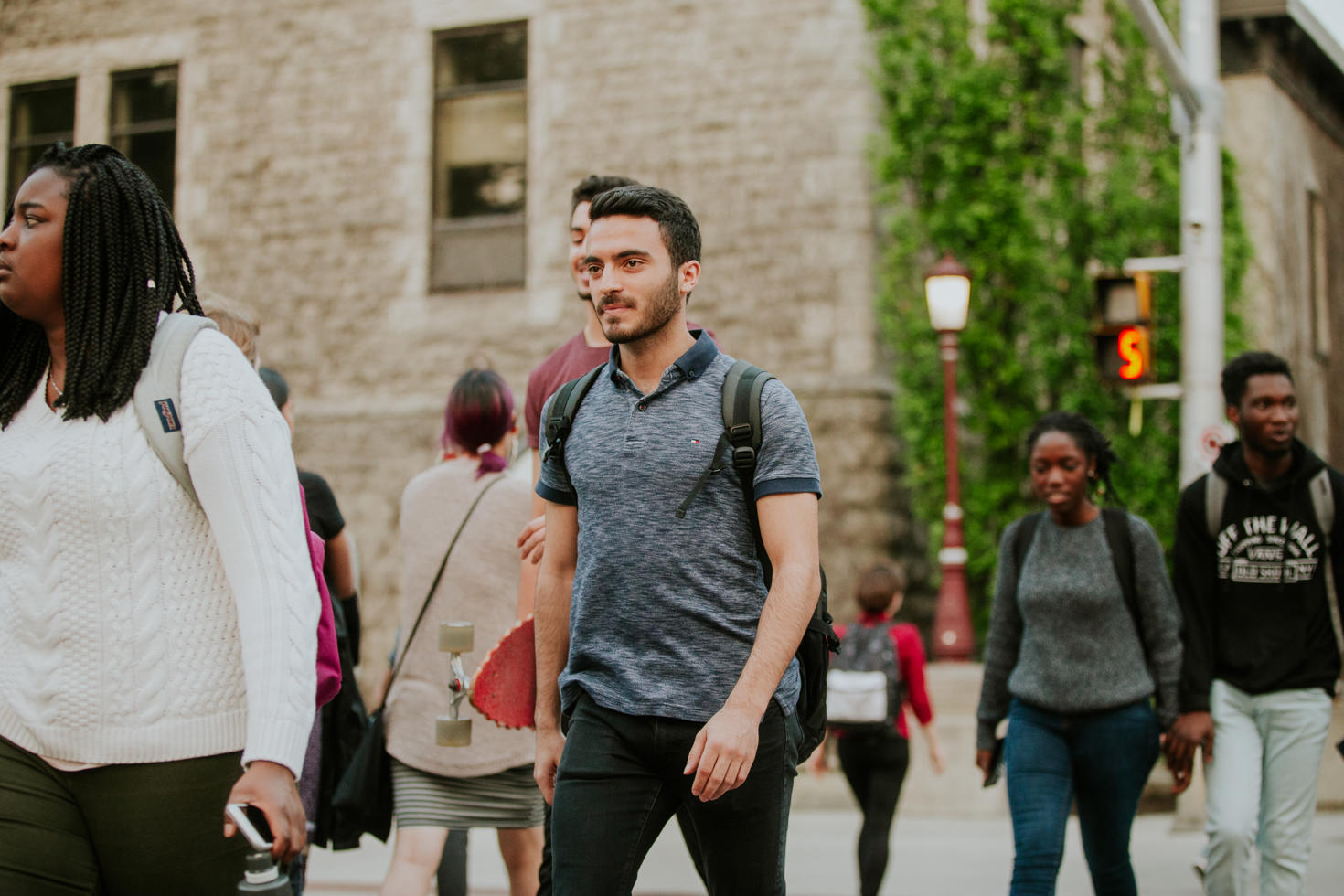 People walking outside around campus.