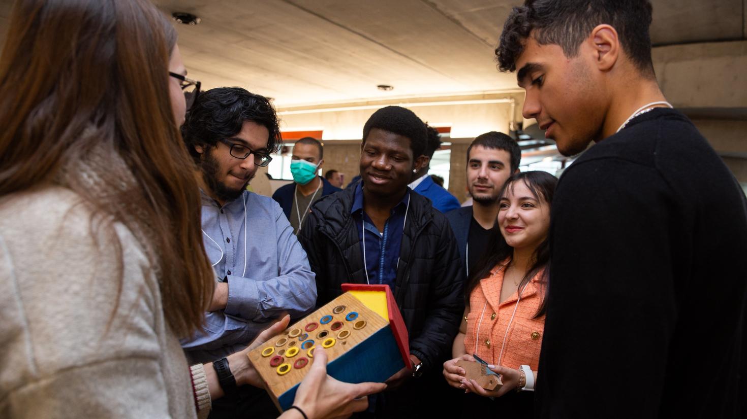 A team present their project to the client.