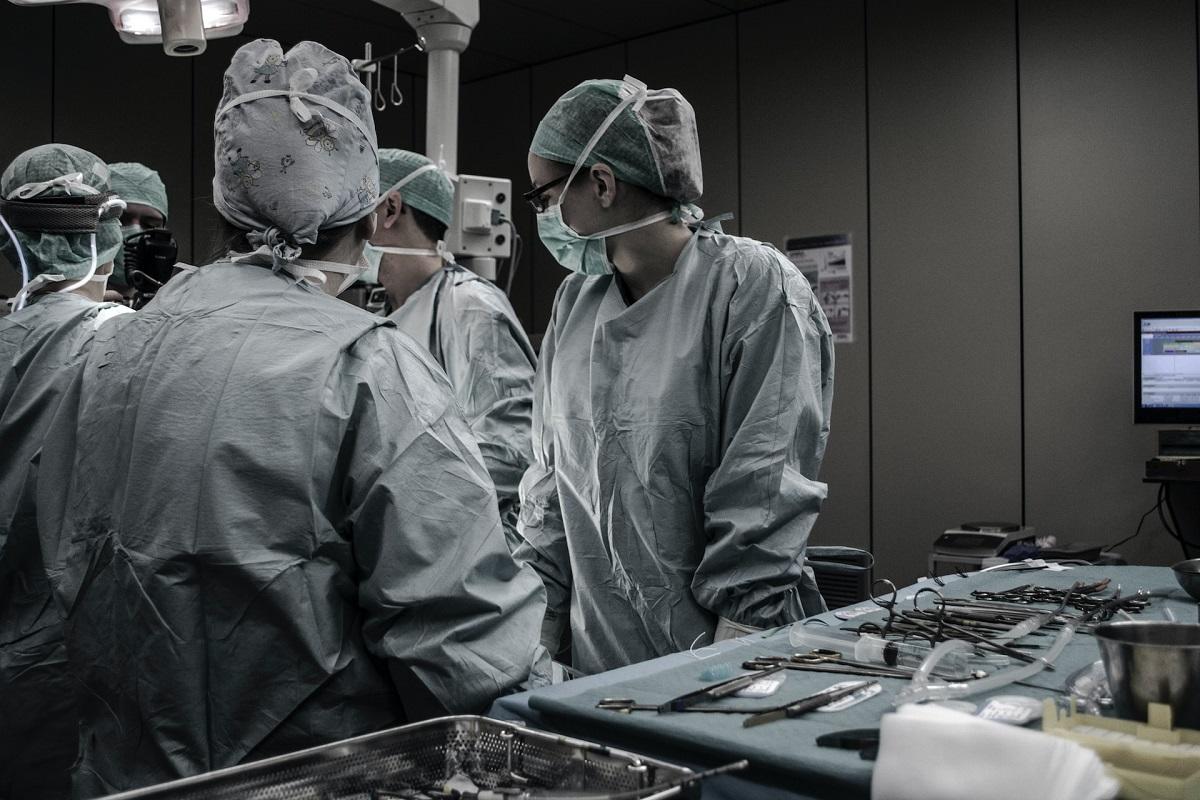 Scrubbed-up healthcare workers in surgery room